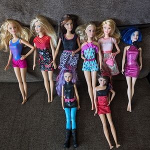 Lot of 8 Barbie Dolls